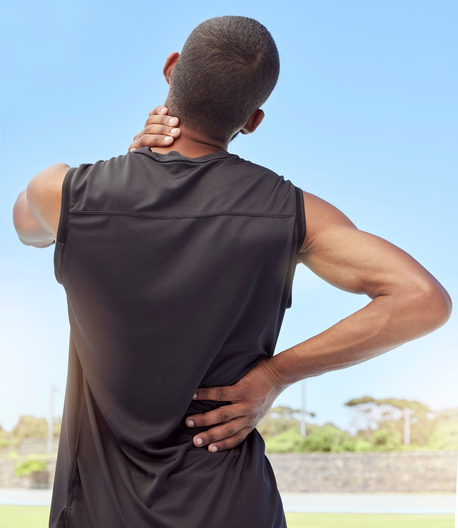 Man holding his neck and lower back in pain